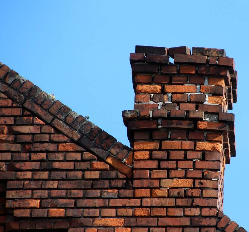 Signs Your Los Angeles Home Needs a Chimney Inspection Damaged chimney on an Los Angeles home showing cracks and missing mortar
